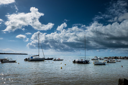 The old small houses of fishermen of Vada, seventy years are set in front of the harbor beach, rich colors of orange, blue, yellow, turquoiseの写真素材