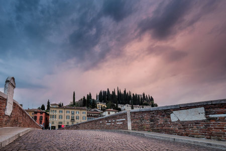 Verona, Italy - Ancient Roman bridge Ponte Pietra and the River Adige, view of Castel San Pietro in background, Verona, Italyの写真素材