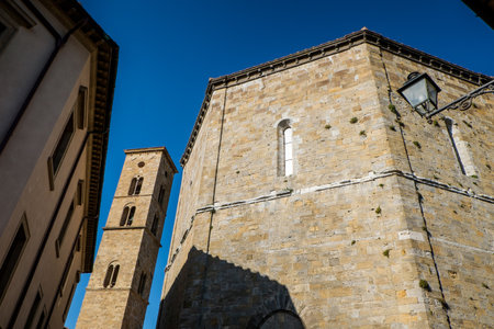 VOLTERRA, TUSCANY - MAY 21, 2017 - Baptistery of San Giovanni Battista and tower of Cathedral of Santa Maria Assuntaのeditorial素材