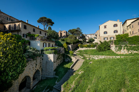 VOLTERRA, TUSCANY - MAY 21, 2017 - The door and the source of San Felice with the staircaseのeditorial素材