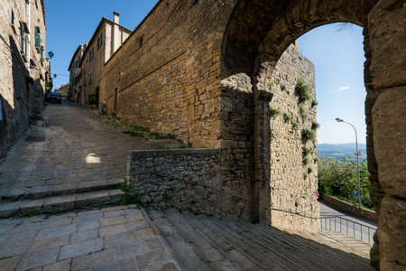 VOLTERRA, TUSCANY - MAY 21, 2017 - The door and the source of San Felice with the staircaseのeditorial素材