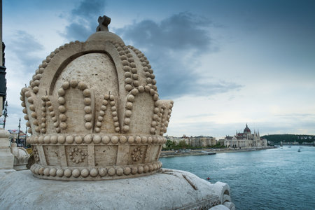 Budapest, Hungary - The Holy Crown on the Margherita Bridge, on background The Parliamentのeditorial素材