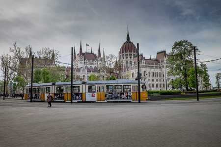 BUDAPEST, HUNGARY - AVRIL 15, 2016: Parliament at the Kossuth Square with the mythical tram 2のeditorial素材