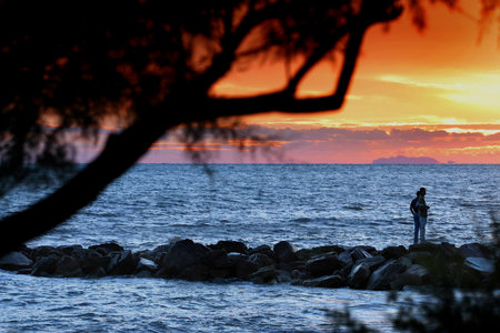 Marina di Cecina, Livorno, Tuscany - Wind of libation at the Gorette with sea-washed day, looking at the lighthouse towards the island of Gorgonaのeditorial素材