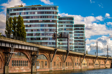 BERLIN, GERMANY - SEPTEMBER 21, 2015: Tour Boat and modern architecture on Spree River in the inner...