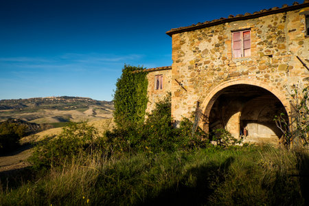 Volterra, Pisa, Italy - November 1, 2017: Hikers depart from Saline for the Volterra hills with panoramic views across the old railway, on background Volterraのeditorial素材