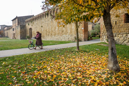 Autumnal trekking in the province of Siena, from Buonconvento village along the Cassia Road, to the confluence of the rivers Arbia and Ombrone then along the historical Via Francigena and the village of Chiusureのeditorial素材