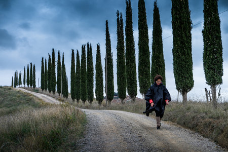 Monte Oliveto Maggiore, Siena, Tuscany - Novembre 12, 2017: Autumnal trekking in the province of Siena, from Buonconvento village along the Cassia Road, to the confluence of the rivers Arbia and Ombrone then along the historical Via Francigena and the vilのeditorial素材