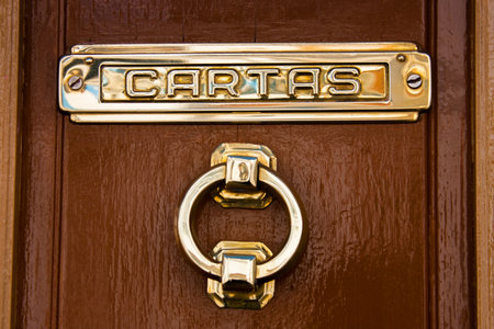 Olvera, CÃ¡diz province, Andalusia, Spain - March 25, 2008: Olvera is one of the White Towns or Pueblos Blancos of Andalusia, brass post boxes in Calle Llianaのeditorial素材