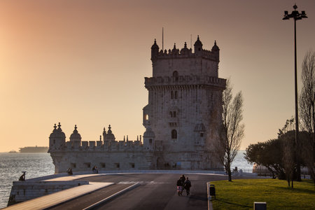LISBON, PORTUGAL - unknown people walks near Belem Tower, 1515-1521, by Francisco de Arruda, Belem district, Lisbon (UNESCO World Heritage List, 1983), Historical Province of Extremadura, Lisbon. Portugalのeditorial素材