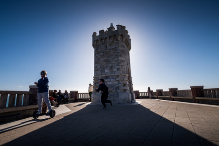 PIOMBINO, TUSCANY, ITALY - Avril 01, 2018:  Piombino, Tuscany, Italy - two children playing in the Bovio square overlooking the Island of Elbaのeditorial素材