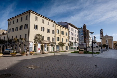 CECINA, TUSCANY, ITALY - March 31, 2018: Piazza Francesco Domenico Guerrazzi with the fountain of the Maremma Assetata created by the artist Emidio Vignali in 1919. The work represents Hercules that overshadows and dominates the Muses of bronze, in the baのeditorial素材