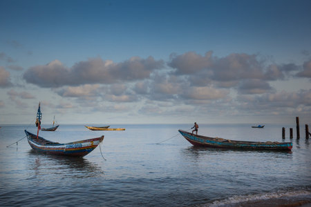 YONGORO, SIERRA LEONE - June 05, 2013: West Africa, unknown person works at the beach with fishing boats in front of the capital Freetown, Sierra Leoneのeditorial素材