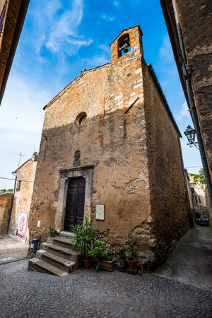 Bibbona, Leghorn, Italy - April 2018 the medieval village of Bibbona in Tuscany, the small Church of...