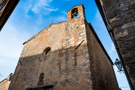 Bibbona, Leghorn, Italy - April 2018 the medieval village of Bibbona in Tuscany, the small Church of San Giuseppe in the historic centerのeditorial素材