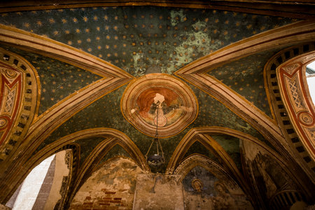 SERRE di RAPOLANO, TUSCANY, Italy - April 25, 2018: trekking in Serre di Rapolano known for the travertine quarries, but from the medieval heart, Siena. Square Chapel and Serremaggio, end of XIV century. Walls are frescoed in late gothic, painted the Blesのeditorial素材