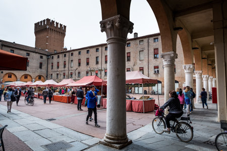 FERRARA, ITALY - May 01, 2018: unknown people in the square of public market near the Cathedral of Saint George, Ferrara, Emilia-Romagna, Italyのeditorial素材