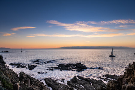 Panoramic view on sunset with sailboat of Castiglioncello, Livorno municipality, Tuscanyの写真素材
