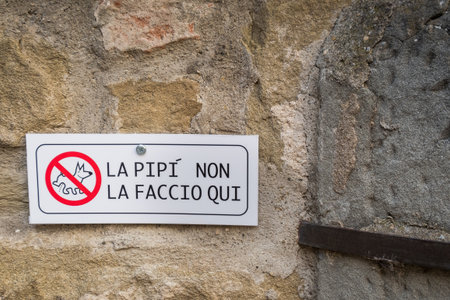 CORTONA, ITALY - MAY 13, 2018: road sign prohibiting dogs from peeing (I'm not here to pee)のeditorial素材
