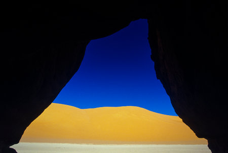 Africa, Algeria, Sahara, Tassili N'Ajjer National Park, Tadrart, rock towers and sand dunesの写真素材