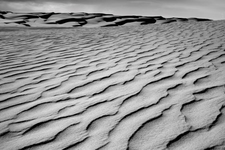 Africa, Algeria, Sahara, Tassili N'Ajjer National Park, Tadrart, rock towers and sand dunesの写真素材