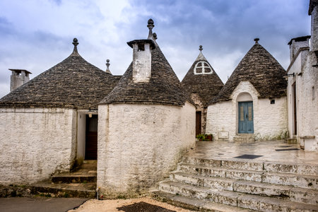 Trulli domes, traditional houses built with dry stone and conical roof, Alberobello,  Valle Itria, small town close to Bari district in Southern Italy, Puglia, Apulia, Italy, Europeの写真素材