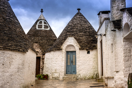 Trulli domes, traditional houses built with dry stone and conical roof, Alberobello,  Valle Itria, small town close to Bari district in Southern Italy, Puglia, Apulia, Italy, Europeの写真素材