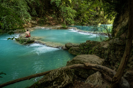 ELSA RIVER, ITALY - SEPTEMBER 15, 2019: one unknown man at Elsa river park, the trail starts in Gracciano and reaches in Colle Val dâElsa (Siena, Tuscany) the river's waters are clear and of an intense turquoise colorのeditorial素材