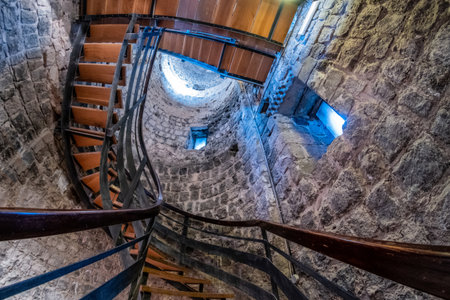VULCI, ITALY - DECEMBER 26, 2019: internal staircase of the archaeological museum of Vulci, an ancient Etruscan city in the territory of Canino and Montalto di Castro, in the province of Viterbo, in the Maremma of Lazio.のeditorial素材
