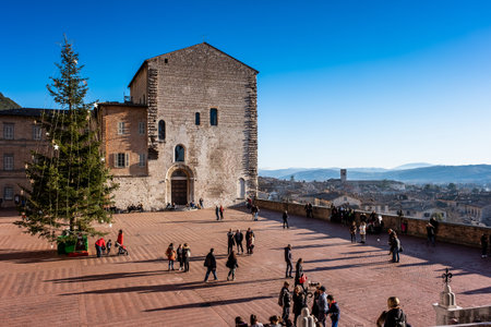GUBBIO, ITALY - JANUARY 01, 2020: unknown people in the Piazza Grande with the Praetorian Palace in Gubbio, a medieval town in Umbria in the province of Perugia, Italyのeditorial素材