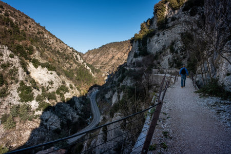 Walking along the medieval aqueduct, it allows you to admire the Bottaccione gorge in Gubbio, a medieval town in Umbria in the province of Perugiaの写真素材