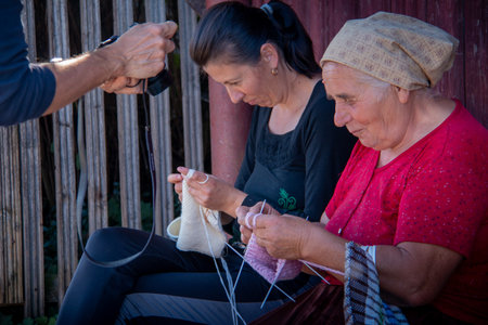 MARAMURES, ROMANIA - OCTOBER 10, 2014: Unknown people working the wool in region of Maramures, the isolated Carpathian region of Romania, is nature to mark the rhythms of life and everything is still tied to the land. Romania, Europeのeditorial素材