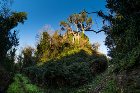 Trekking in the medieval village of Ripafratta with the fortress of San Paolino stands on the banks of the Serchio river, in the municipality of San Giuliano Terme, Pisa, Tuscanyの写真素材