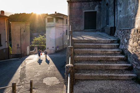 GERFALCO, ITALY - SEPTEMBER 06, 2020: two unknown people stroll in the small villageのeditorial素材