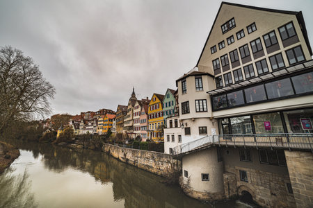 Tubingen, Germany - December 24, 2017

Medieval German houses reflecting on the River Neckar (Neckarfront) with Stiftskirche St Georg bell tower sticking out of the half timbered buildingsのeditorial素材