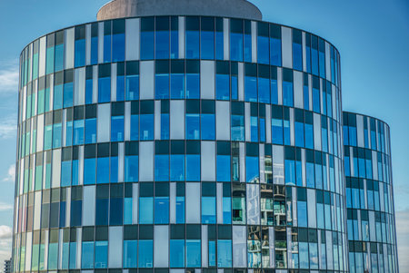 Cylindrical glazed modern office or corporate offices circular towers in Nordhavn financial district convey employment, corporate concept. Illustration for business and banking - Copenhagen, Denmarkのeditorial素材