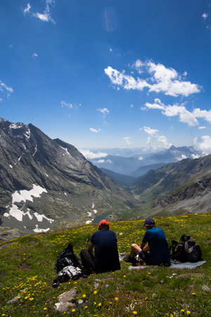 hikers looking at the landscape resting on top Losetta