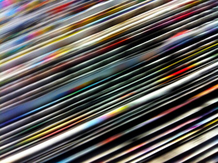 Bunch of newspapers passing too fast. の素材