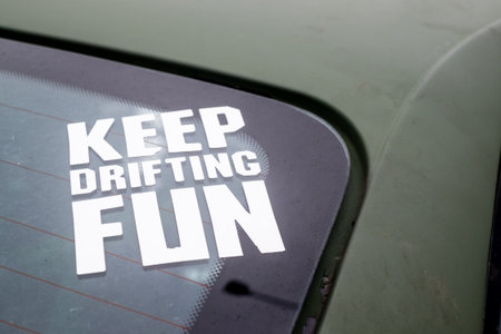 Keep drifting fun slogan on a drifting car in Polandの写真素材