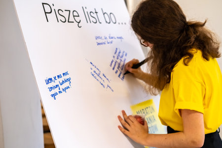 Warsaw / Poland - December 9, 2018: "Write for Rights" is the world's biggest human rights event organized by Amnesty International. Over 200 000 letters are sent from Poland every year to those, whose human rights are being attacked. This young woman is のeditorial素材