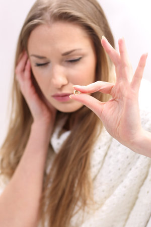 Young woman with a pillの写真素材