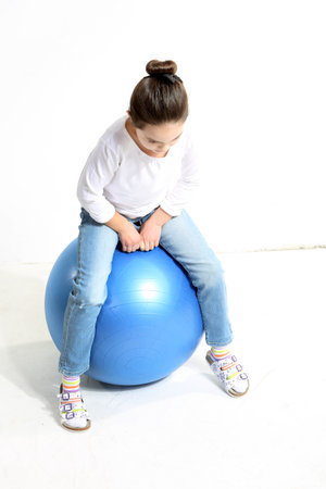 Little girl posing with a a rubber ballの写真素材