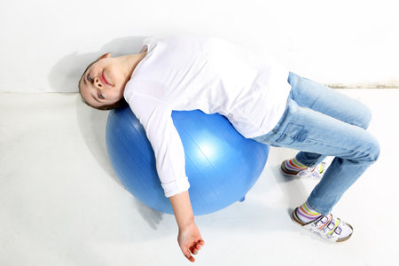 Little girl posing with a a rubber ballの写真素材
