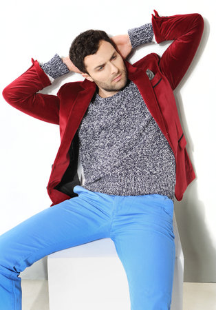 Handsome man posing in a red jacketの写真素材