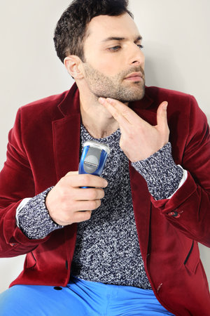 Portrait of male chin and electric shaveの写真素材