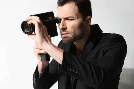 Attractive man taking photoの写真素材
