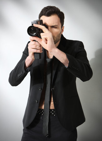 Attractive man taking photoの写真素材