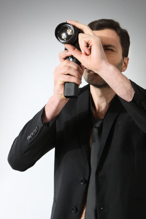 Attractive man taking photoの写真素材