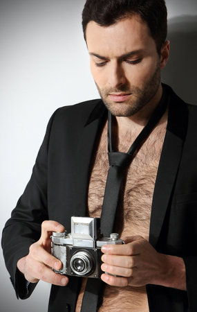 Attractive man taking photoの写真素材