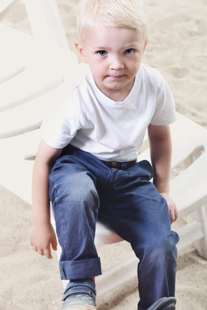 Beautiful little boy on the beachの写真素材